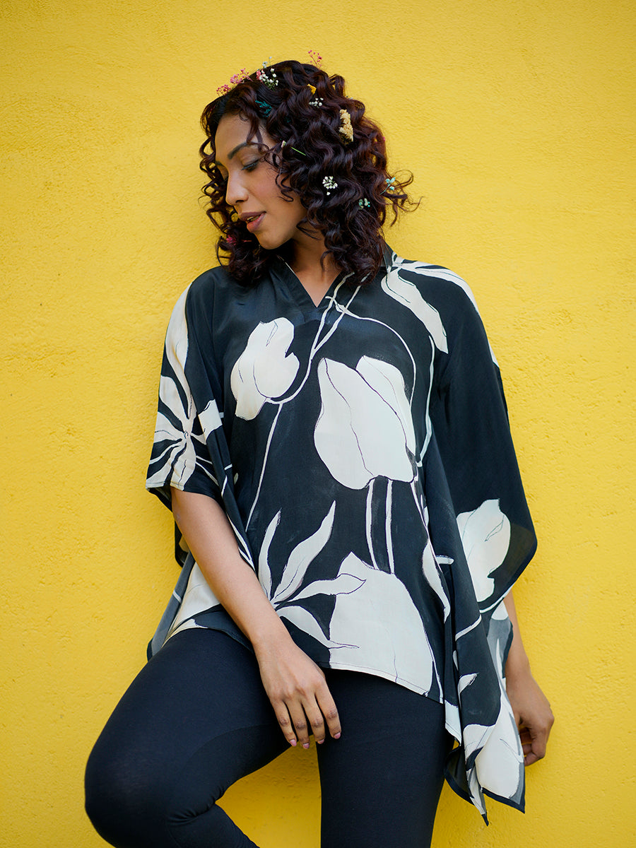 "Front view of the relaxed fit Black Ivy Crepe Kaftan Top with elegant ivy print and chic flowy sleeves."