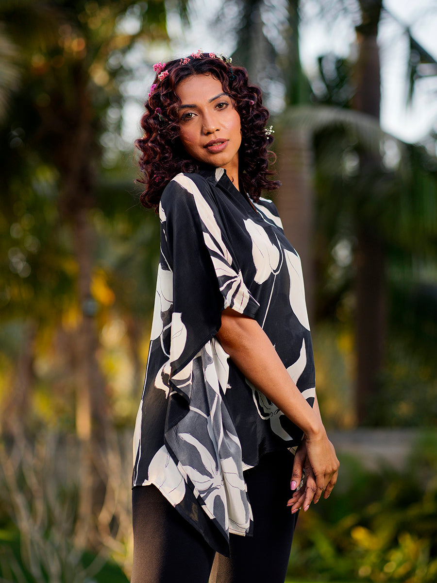 "Front view of the Black Ivy Crepe Kaftan Top with black and white ivy print, relaxed fit, and flowy sleeves."