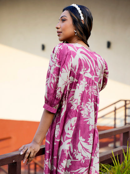 Back view of the Cherry Blush Breezy Flow Dress, highlighting the simple yet elegant design and knee-length fit in soft muslin fabric."