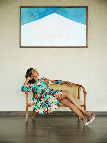 "Model showcasing the Abstract Printed Short Dress with a geometric print, standing confidently in a chic, resort-style look."

