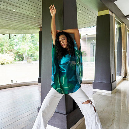 "Model posing in Beat the Blues Kaftan Top, perfect for casual and festive wear."