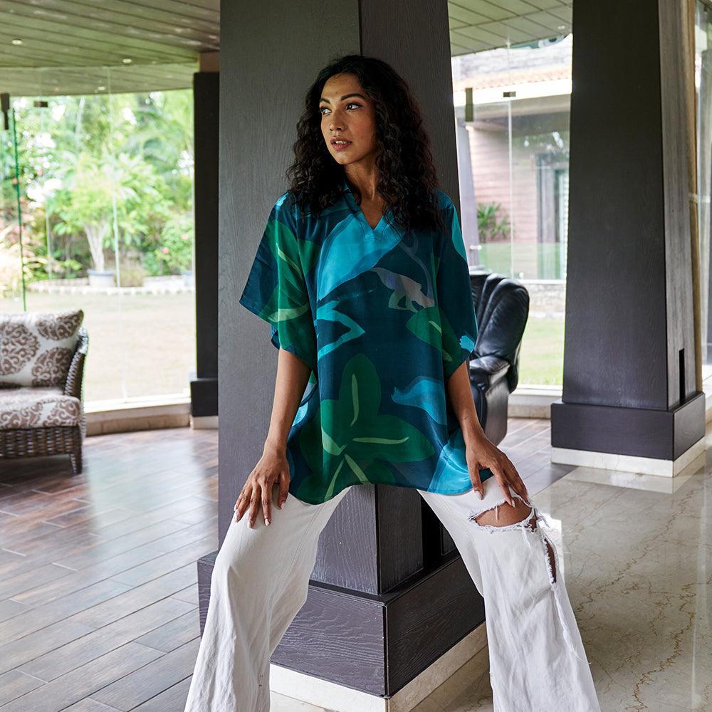 Full view of the Beat the Blues Kaftan Top in Blue & Hues of Green, styled with accessories."
