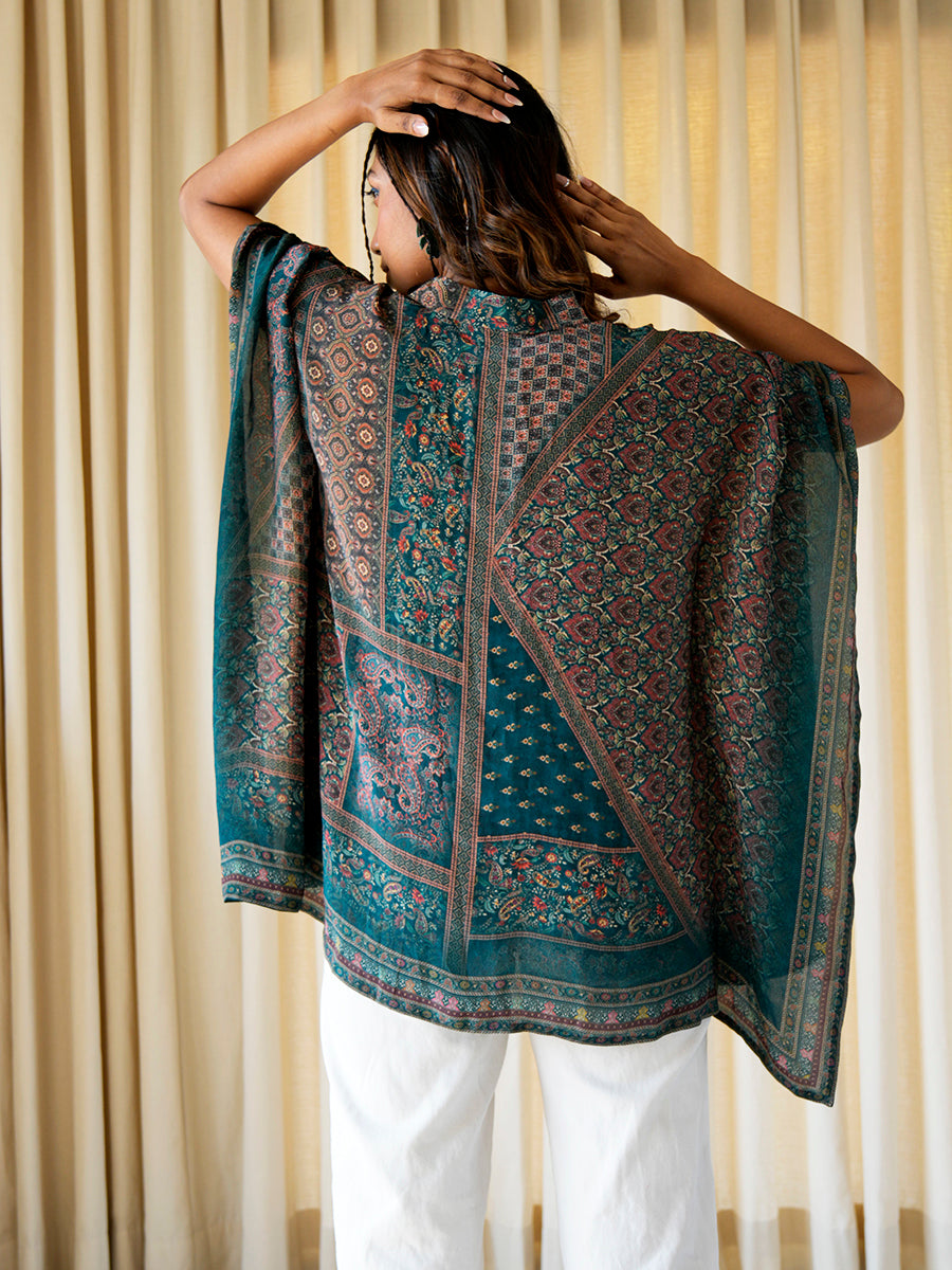  Backside of the abstract printed kaftan top, showing the full coverage and elegant flow.