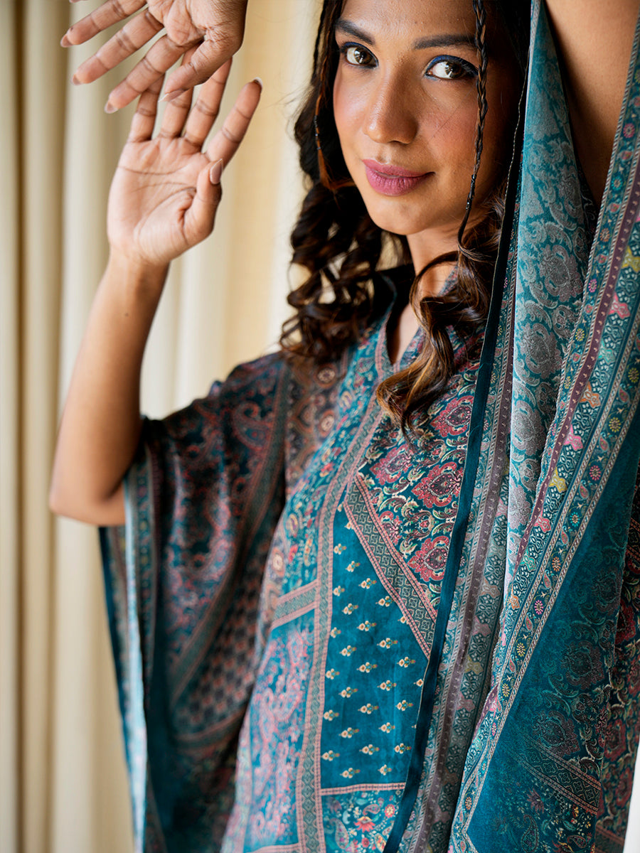  Detailed view of the abstract print and smooth crepe silk fabric of the kaftan top