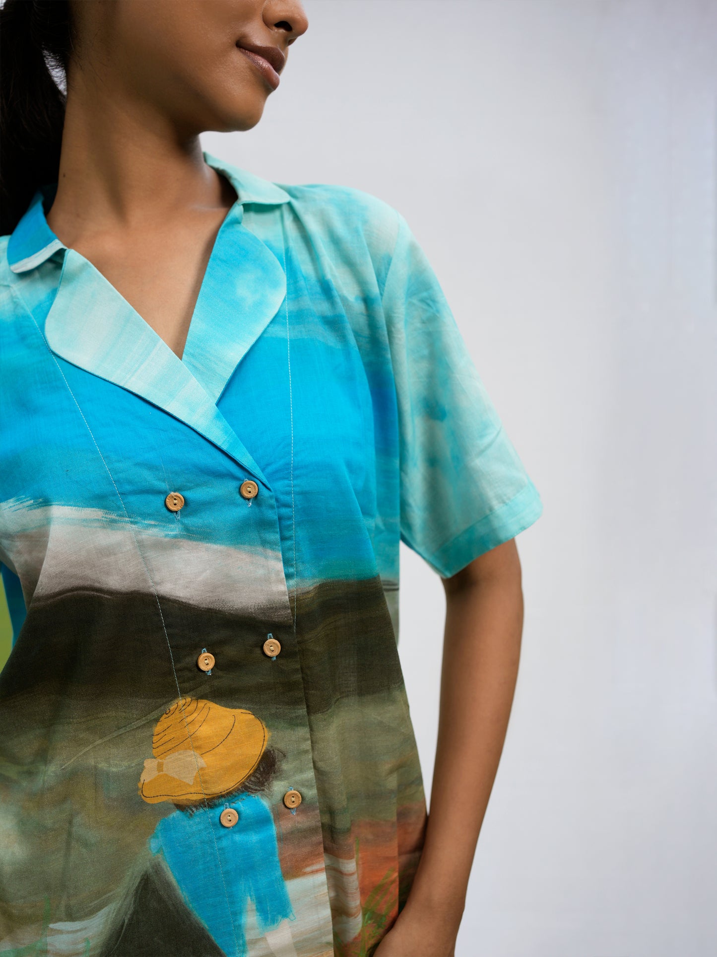 Side profile of relaxed fit Philippino shirt top in breathable rayon fabric
