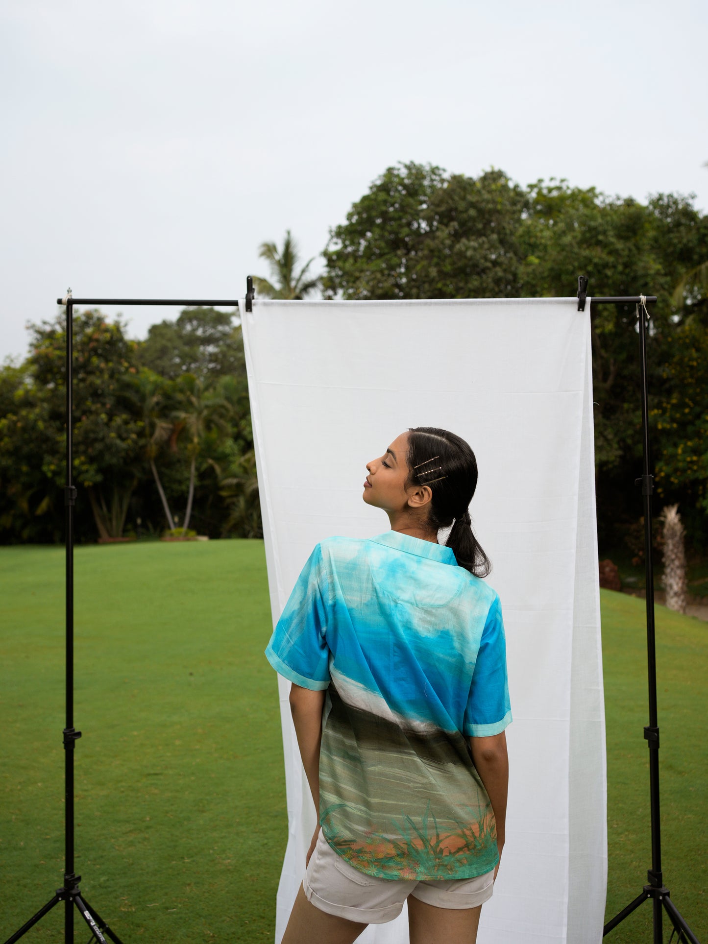 Back view of Philippino shirt top featuring multicolor tropical pattern
