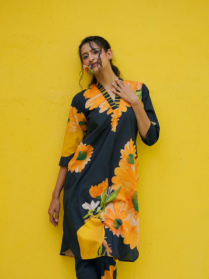 Close-up of soft cotton fabric with vibrant yellow sunflower print and fine stitching details
