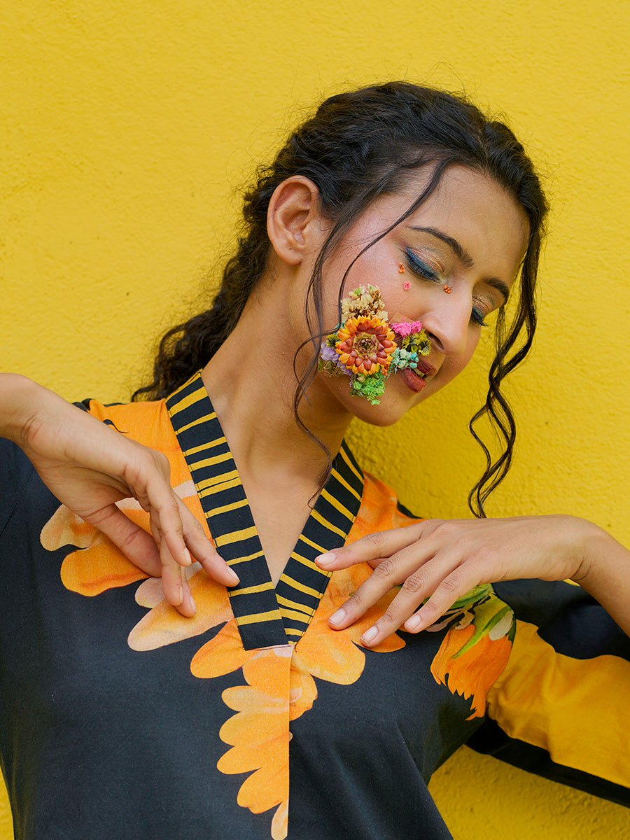 Close-up of breathable cotton fabric with sunflower print detailing