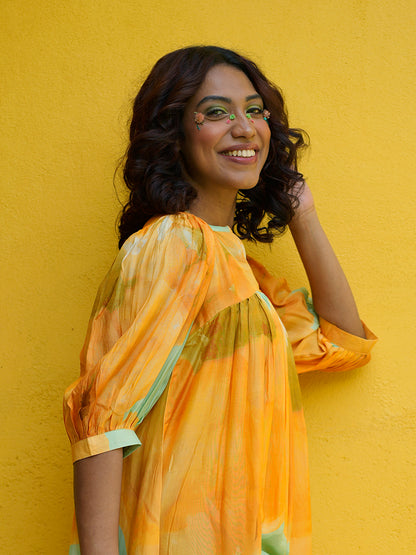 Detailed view of 15-inch sleeves with subtle pintuck and floral print on muslin fabric

