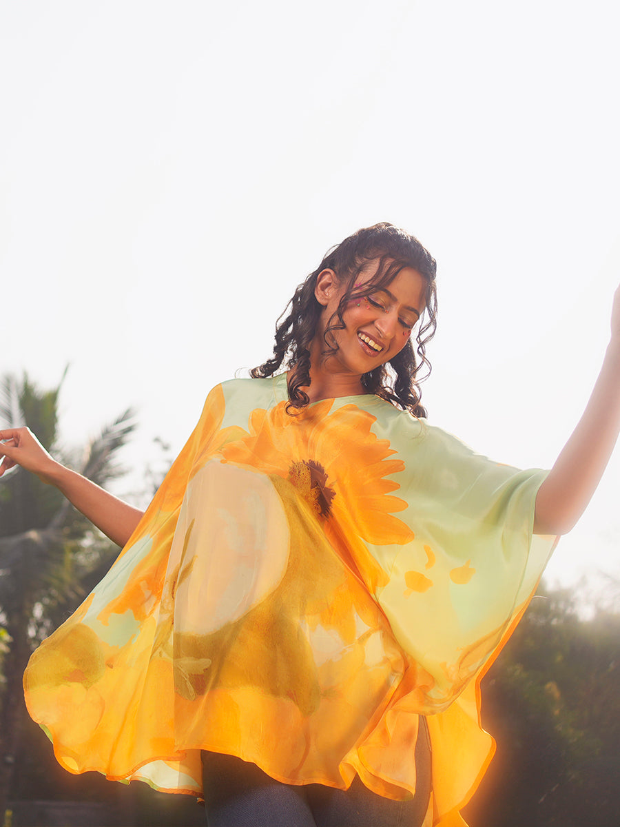 Side view highlighting the flowing silhouette and lightweight crepe fabric of the sunflower-printed kaftan top.