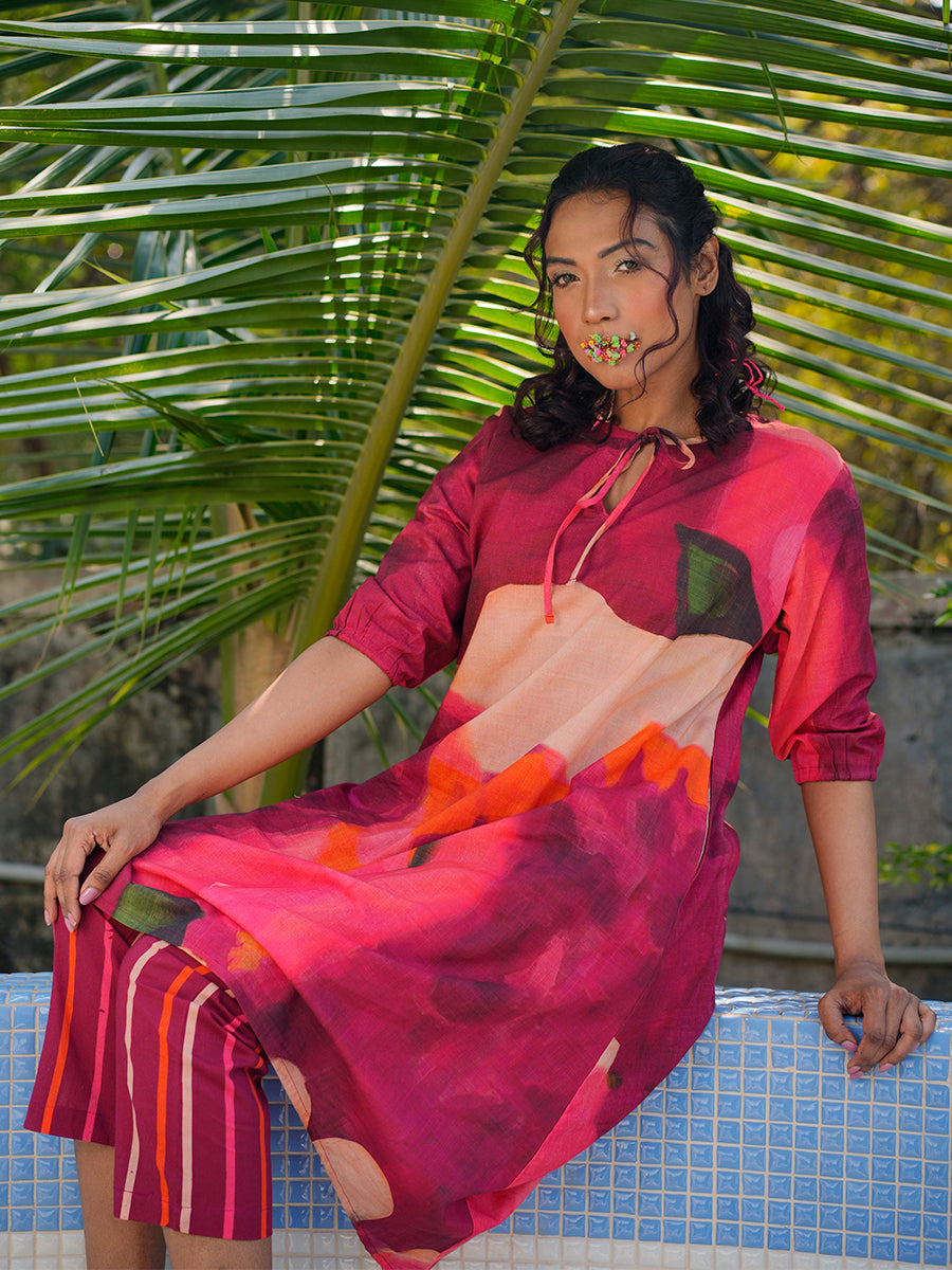 Side profile of cherry long cotton kurta co-ord set showing flowy silhouette and matching bottom